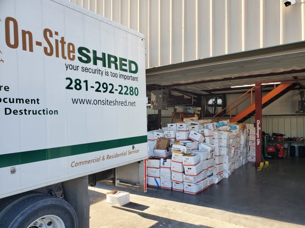 Shredding service truck with boxes inside.